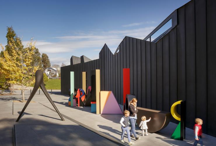 Family walks next to sculptures at the Heide Museum of Modern Art © Heide Museum of Modern Art