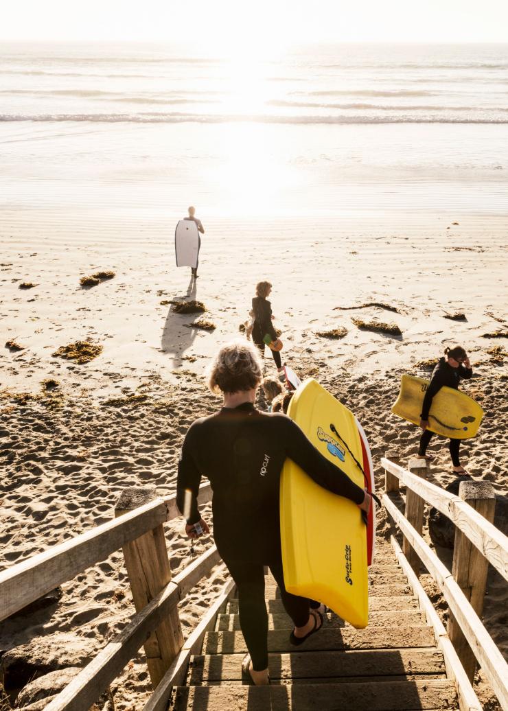 Surfers at a beach in Port Fairy © Belinda Van Zanen Media