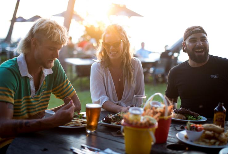 Friends enjoying dinner at Darwin Ski Club © Tourism NT/Cait Miers