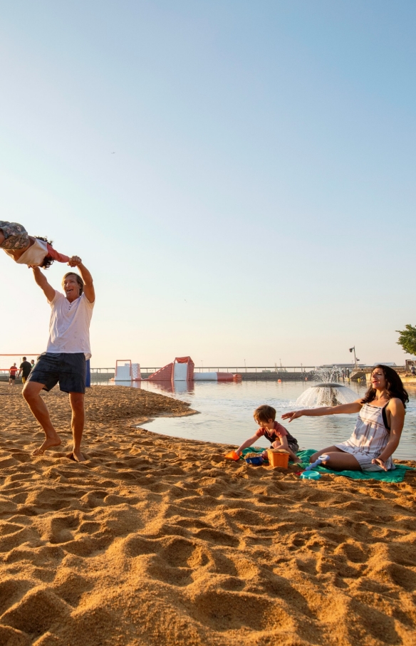 Family enjoying time together at the Waterfront lagoon at Darwin's Waterfront in the Northern Territory © Tourism NT/Shaana McNaught