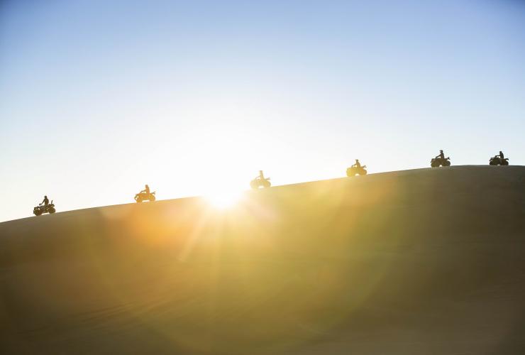 Zip over the largest moving sand dunes in the Southern Hemisphere, which you can only visit with a guide from Sand Dune Adventures © Destination NSW
