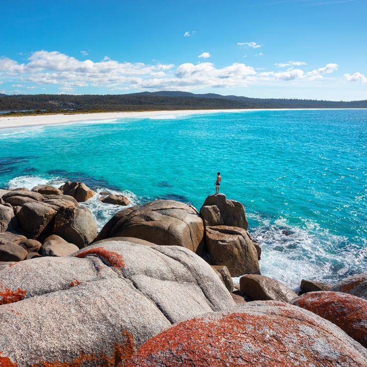 Man on rock at Sloop Reef near the Bay of Fires © Tourism Australia/Daniel Tran Man on rock at Sloop Reef near the Bay of Fires © Tourism Australia/Daniel Tran