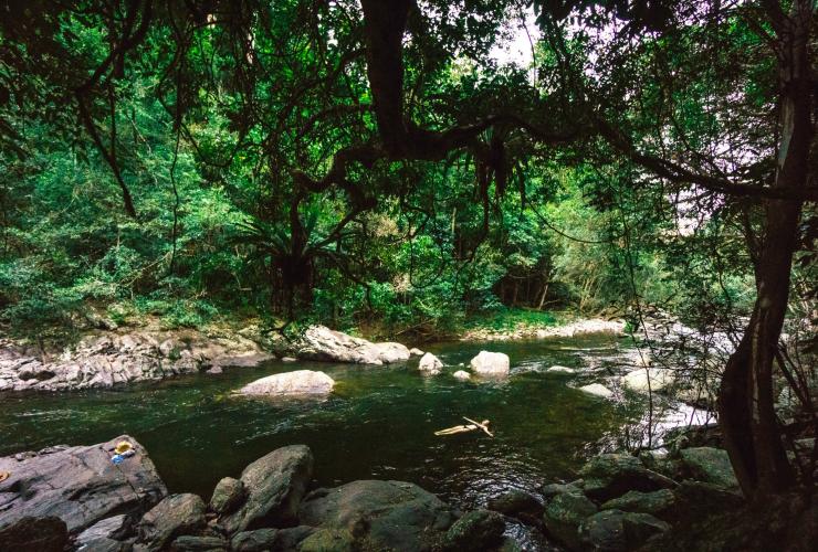 Woman swims in a Rockpool at Mossman Gorge in the Daintree National Park in Queensland © Tourism Tropical North Queensland