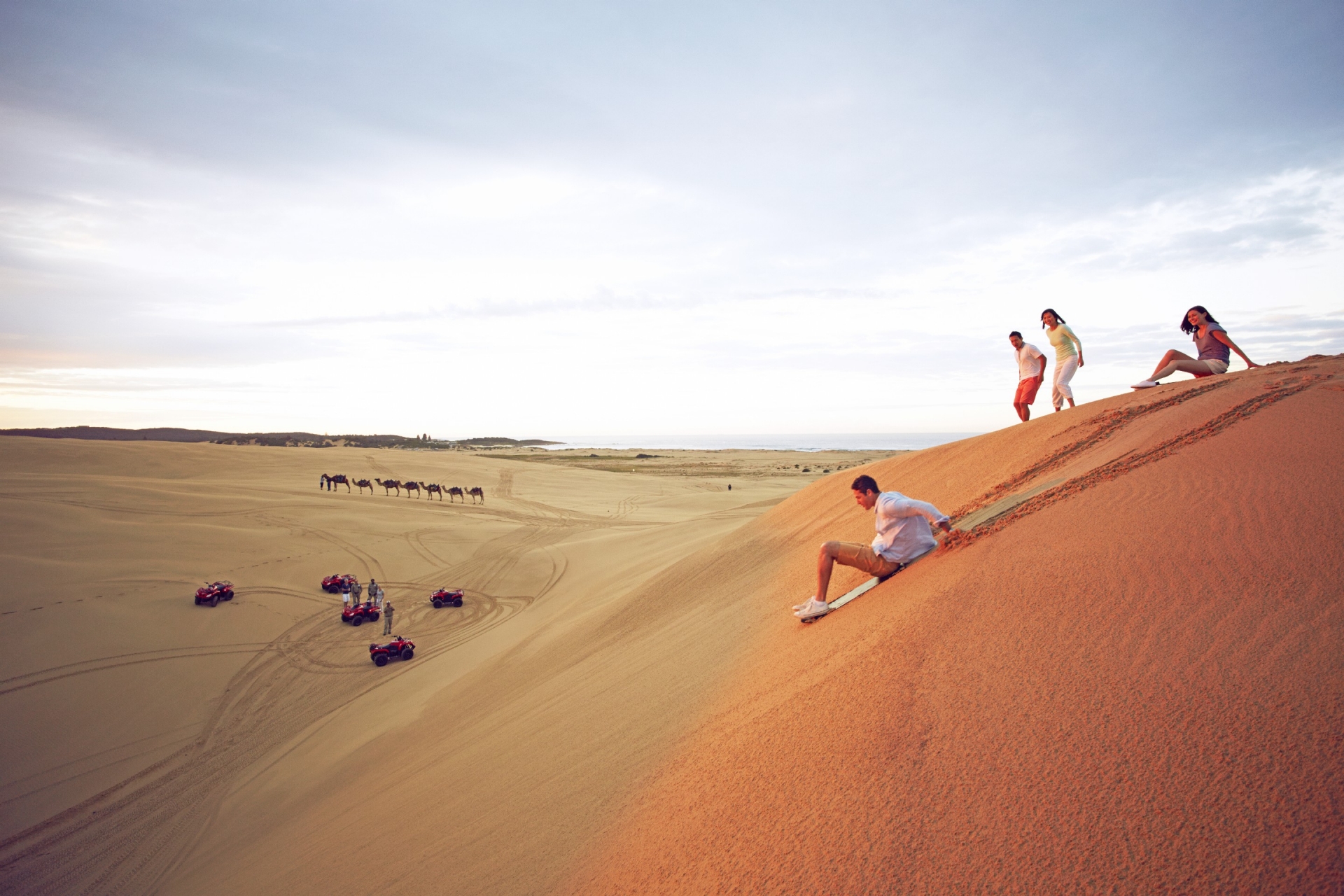 Sandboarding at Stockton Beach, Port Stephens, New South Wales © Tourism Australia