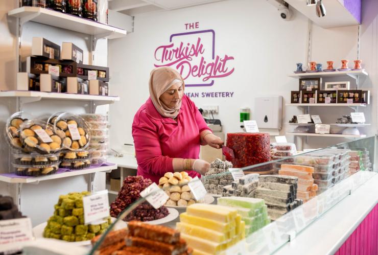A woman preparing sweets at The Turkish Delight, Adelaide Central Markets, Adelaide, South Australia © Lewis Potter