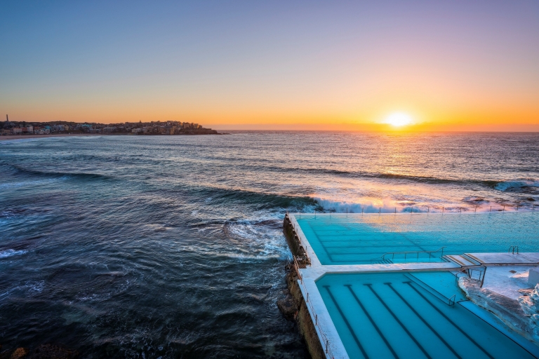 Morning sun rising over Bondi Icebergs, Bondi Beach © Destination NSW