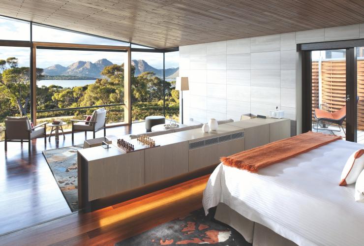 Interior of luxury accommodation with floor to ceiling windows boasting views across Freycinet at Saffire Freycinet, Peninsula, Tasmania © Saffire Freycinet