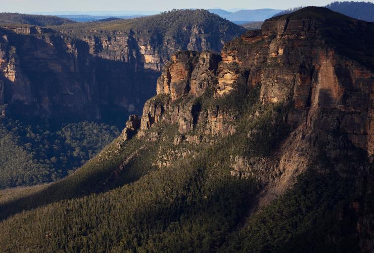 View overlooking lush green bushland covering mountains and valleys along the Grand Canyon Walking Track, Blue Mountains, New South Wales © Destination NSW