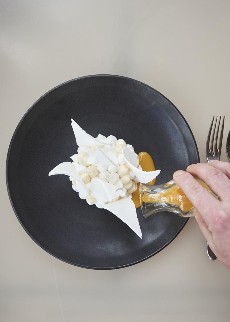 An aerial view of the signature pavlova dish at Bennelong restaurant, with shards of meringue sticking up to replicate the sails of the Sydney Opera House, Sydney, New South Wales © Destination NSW