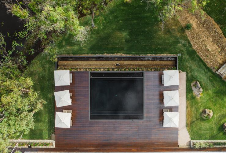 Aerial of the swimming pool and surrounding deck and greenery at Mt Mulligan Lodge, Mt Mulligan, Queensland © Tourism Australia