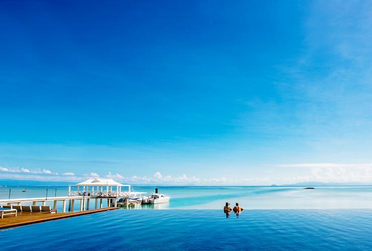 Couple overlooking the ocean from the infinity pool at Orpheus Island Lodge, Orpheus Island, Queensland © Orpheus Island