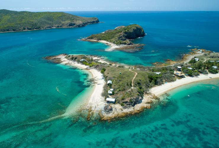 Aerial view over the white shores, blue water and lush greenery of Pumpkin Island, Southern Great Barrier Reef, Queensland © Tourism and Events Queensland