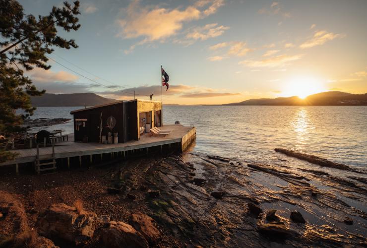 The sun setting over the ocean with a  Satellite Island, Tasmania © Jason Charles Hill