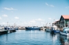 Blue boats sitting on the calm water of Hobart Harbour in Hobart, Tasmania © Adam Gibson
