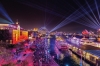 Aerial view over a harbour city adorned in rainbow lights during Vivid Sydney, Sydney, New South Wales © Destination NSW
