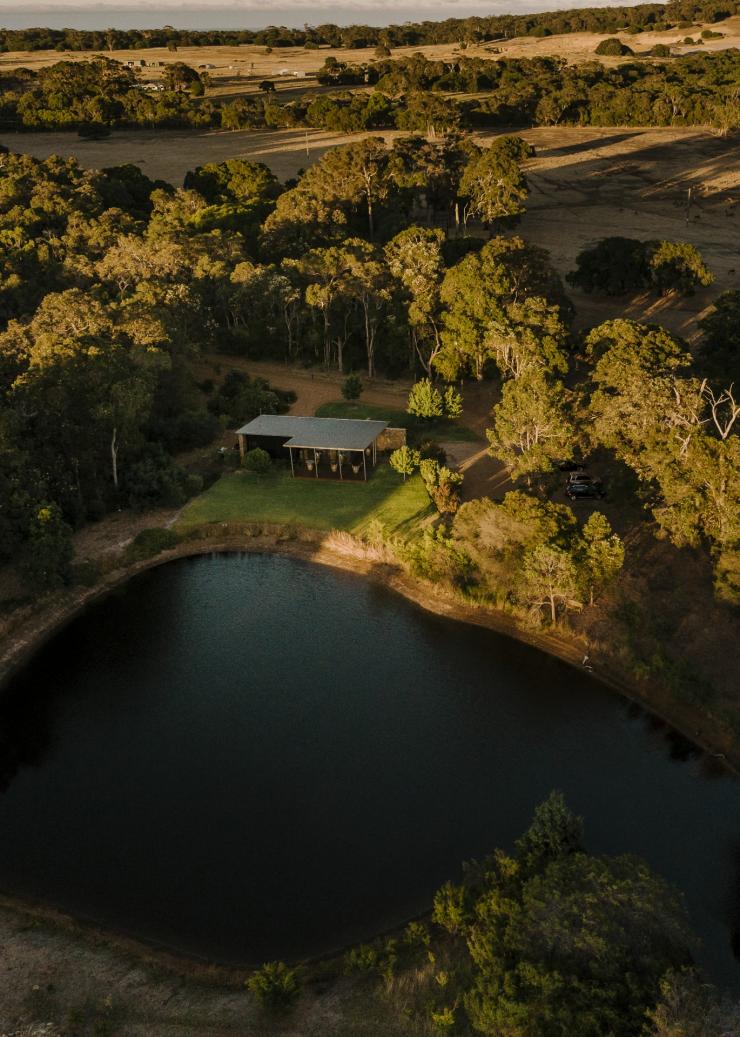 Aerial view over a vineyard and small lake surrounded by trees at Passel Estate, Margaret River, Western Australia © Tourism Australia