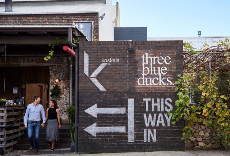 Couple exiting Three Blue Ducks, Rosebery, New South Wales © Destination NSW